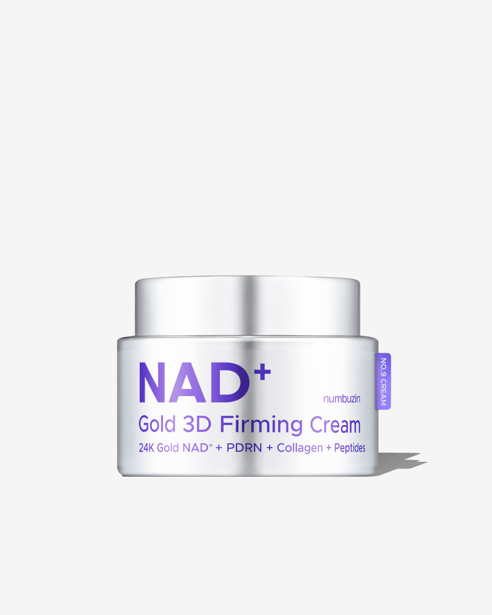 A white cosmetic jar of NAD+ Gold 3D Firming Cream by numbubi, featuring purple text and a small purple side tag, set against a clean white background with a soft shadow.