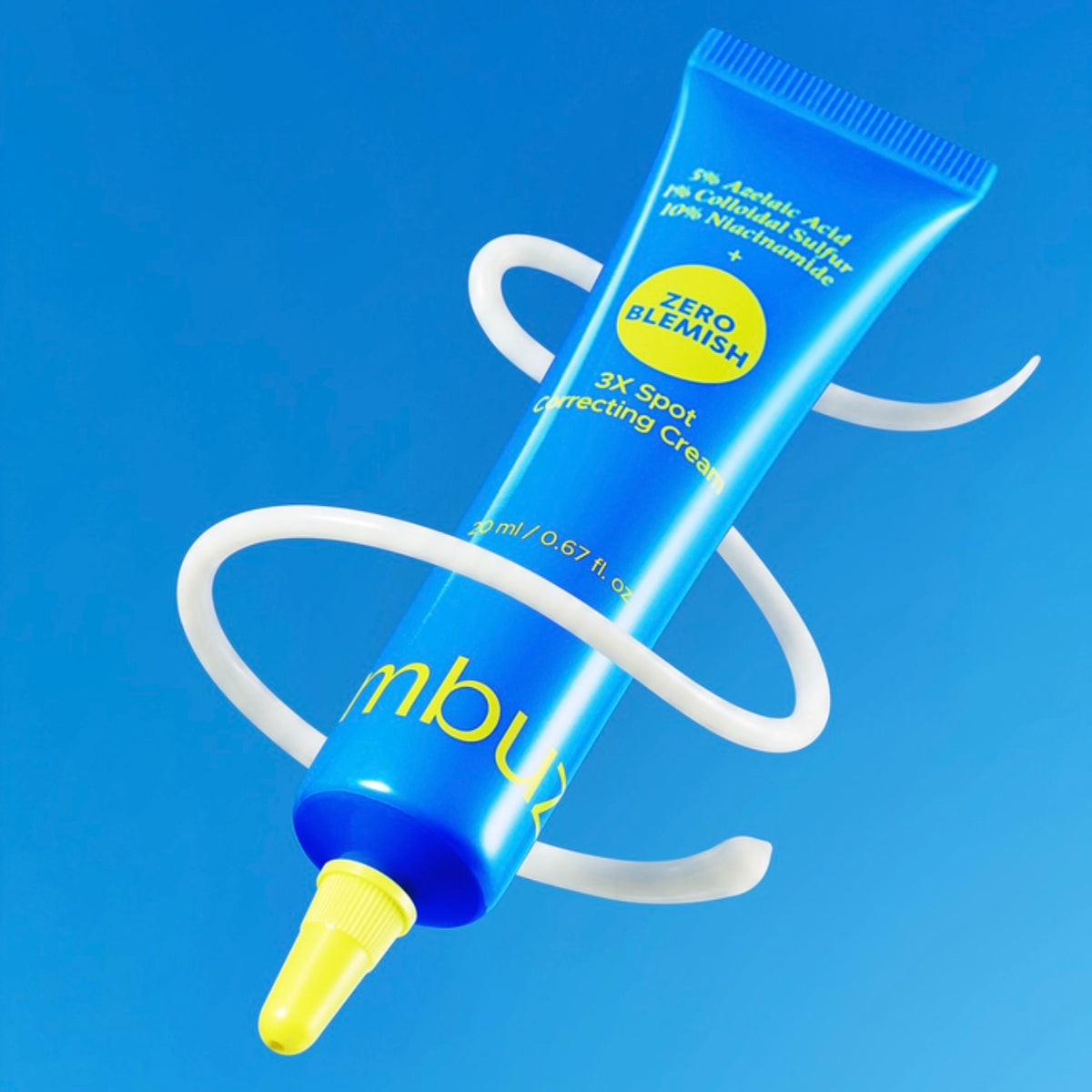 Blue tube of numbuzin Zero Blemish 3X Spot Correcting Cream, 20 ml, listing 5% azelaic acid, 1% colloidal sulfur and 10% niacinamide, with a ribbon of white cream swirling around it against a blue background.
