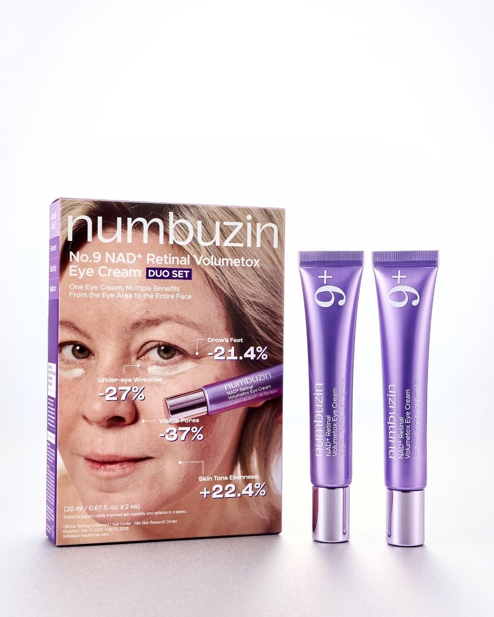 Numbuzin No.9 NAD Retinal Volumectoxy Eye Cream Duo Set, featuring the product box with a model's face and two purple squeeze tubes with silver caps, on a white background.